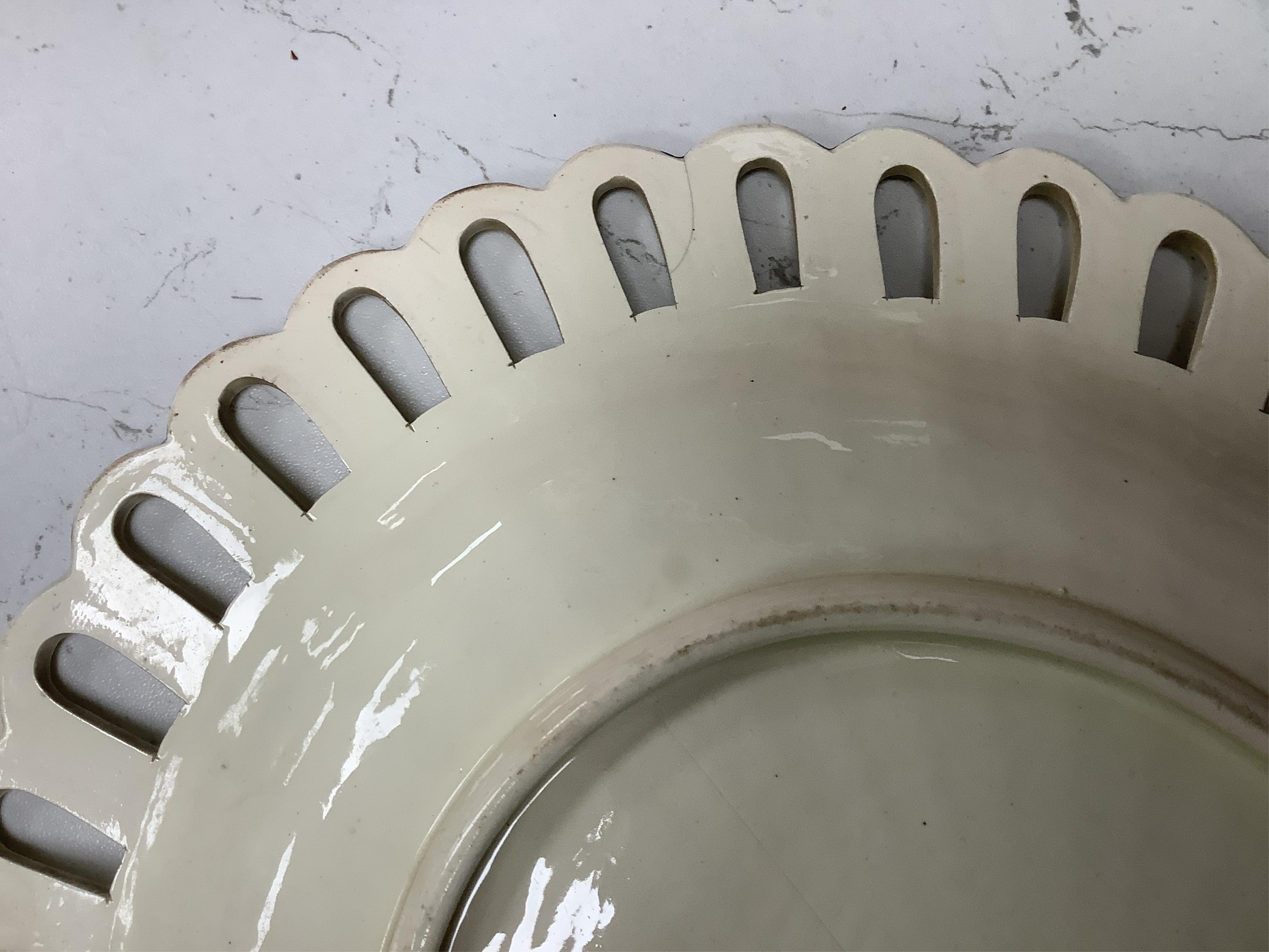 Two early 19th century Wedgwood Queensware oval twig baskets and three oval dishes. Largest basket 28cm wide.